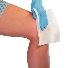 Medical wipe being applied to knee