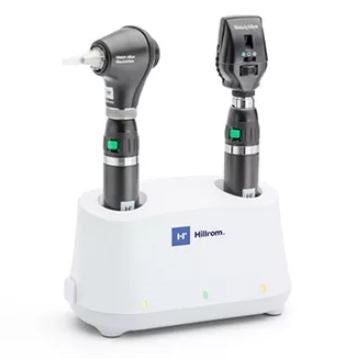 Two medical devices on a white stand with 'Hillrom' branding.